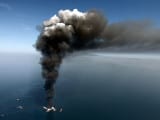 A large plume of smoke rises from fires on BP's Deepwater Horizon offshore oil rig, in April 2010. Gerald Herbert/AP