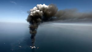 deepwater horizon 630px 300x169 - A large plume of smoke rises from fires on BP's Deepwater Horizon offshore oil rig, in April 2010. Gerald Herbert/AP