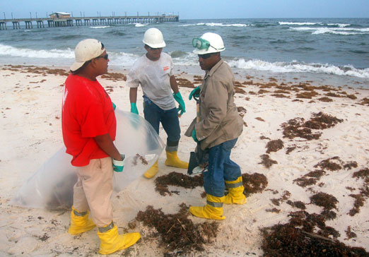 beach workers1b - Federal Judge Grants Final Approval on BP Settlement for 2010 Gulf Oil Disaster